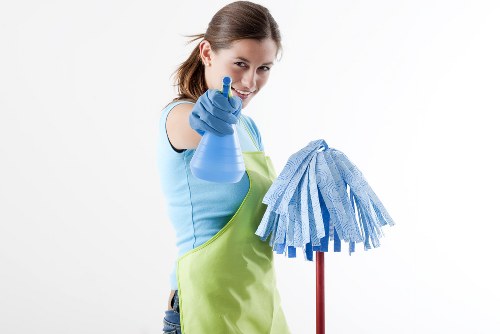 Professional oven cleaner in Kingston upon Thames deep cleaning a kitchen oven