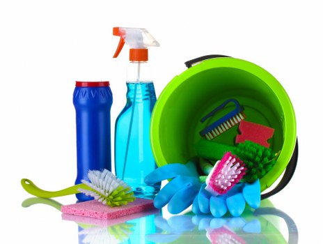 Cleaner preparing supplies with safety focus in a Kingston upon Thames property