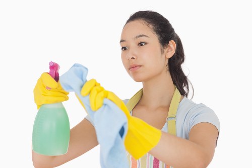 Professional cleaner reviewing booking details and property information