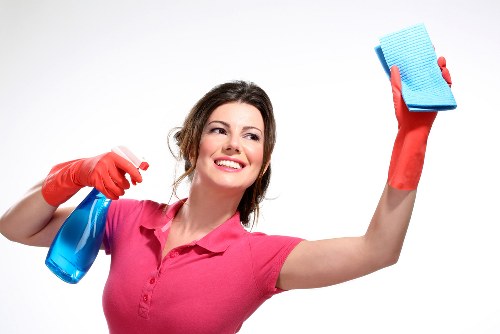 Cleaner preparing a tidy living room in Kingston upon Thames